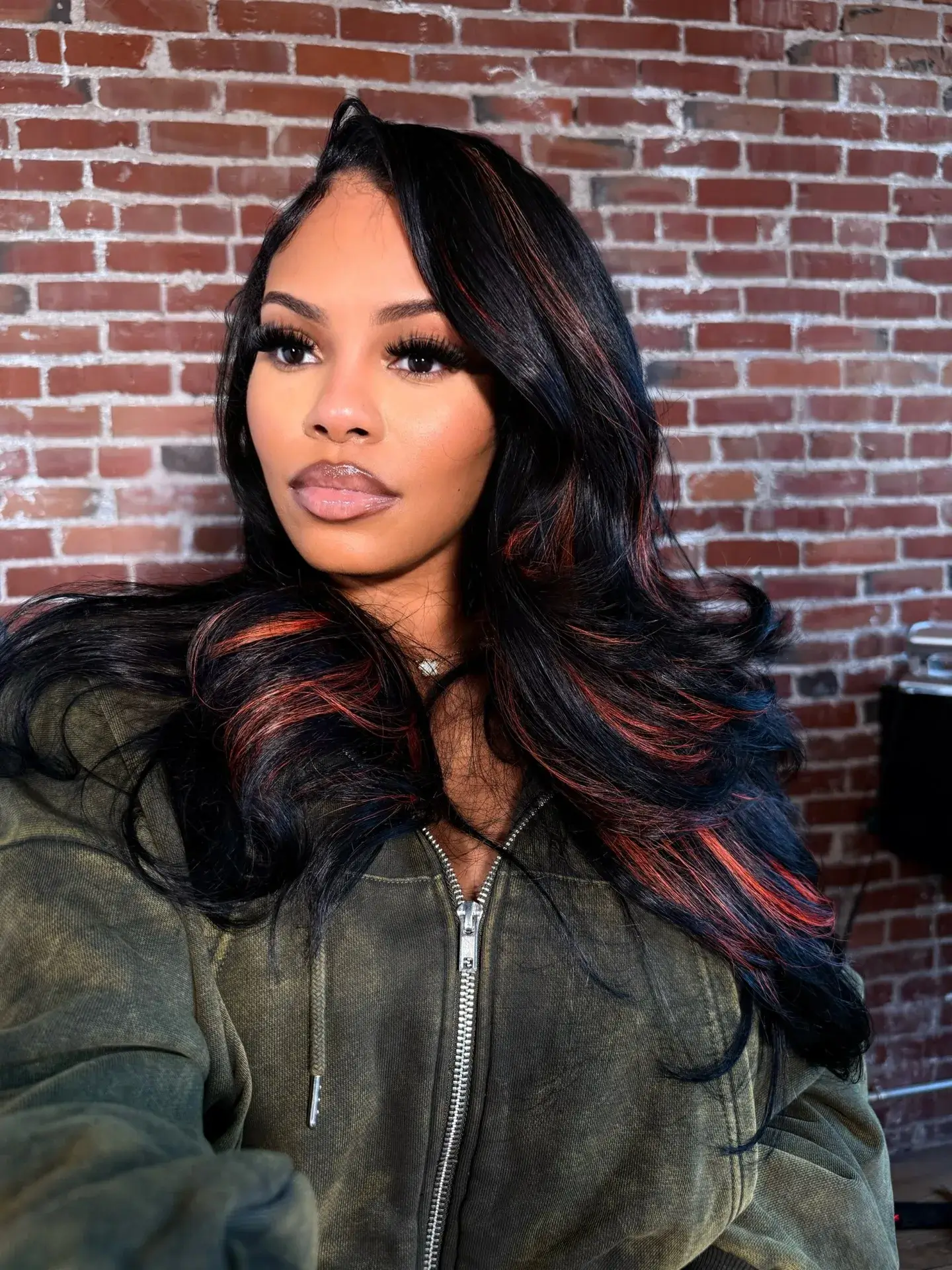 Black Waves With Auburn Highlights