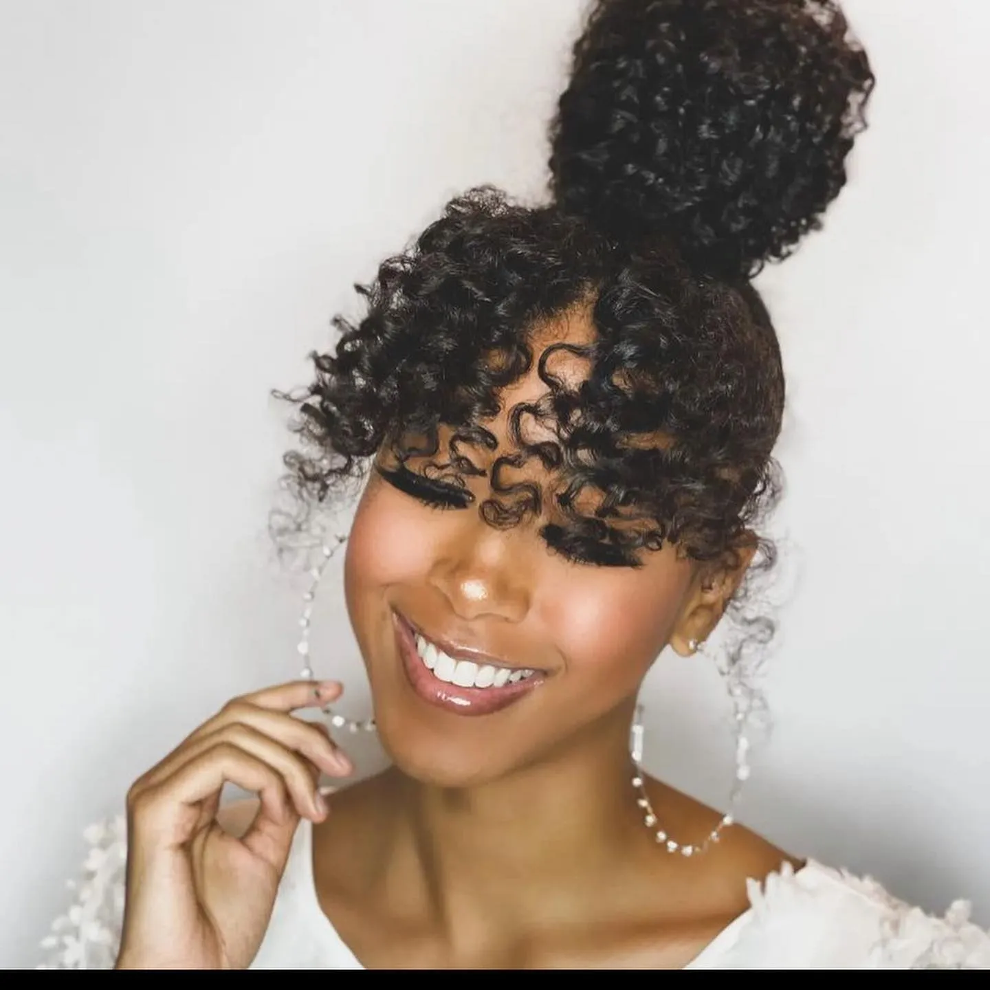 Curly High Puff With Tendrils
