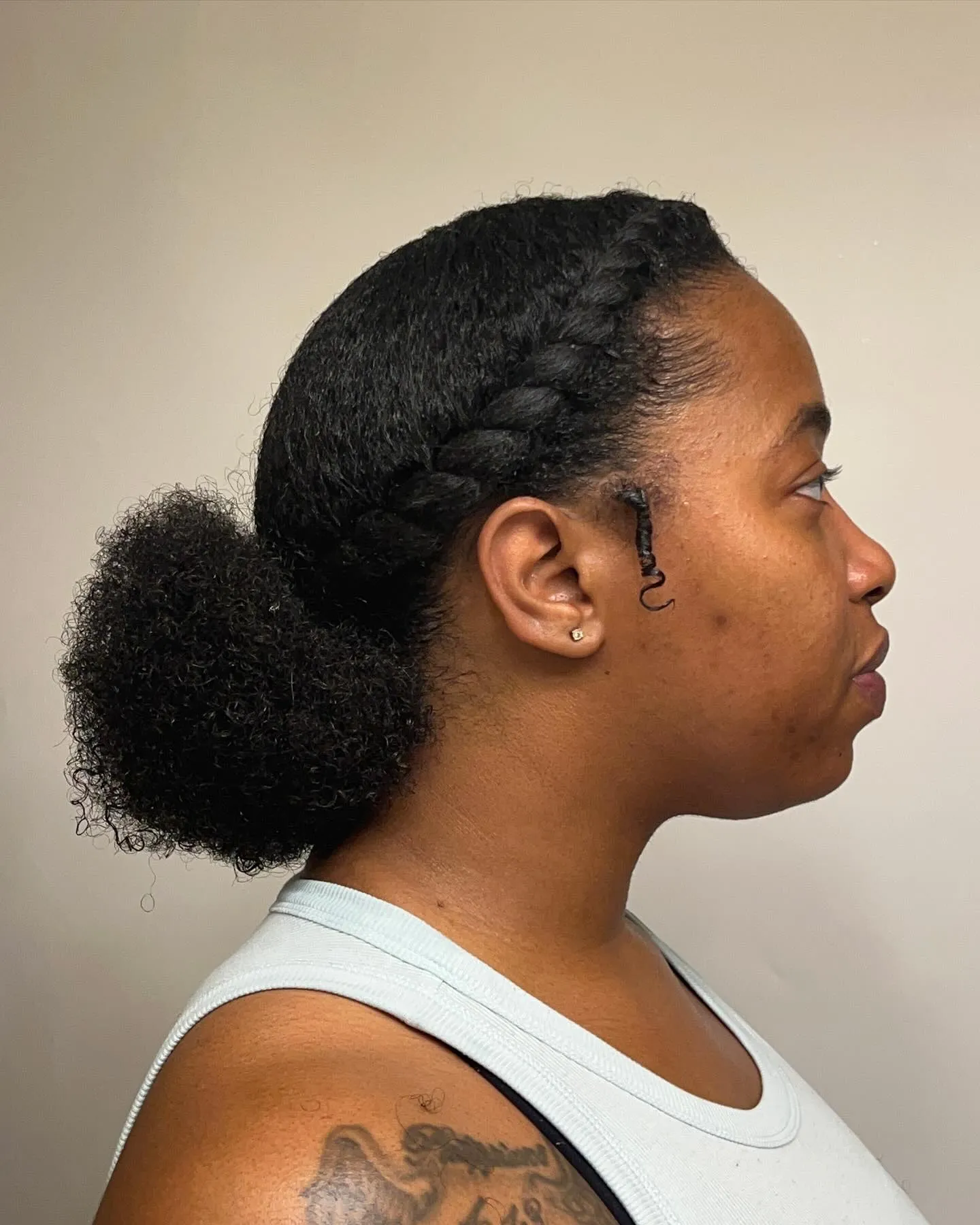 Low Afro Puff With Side Braid