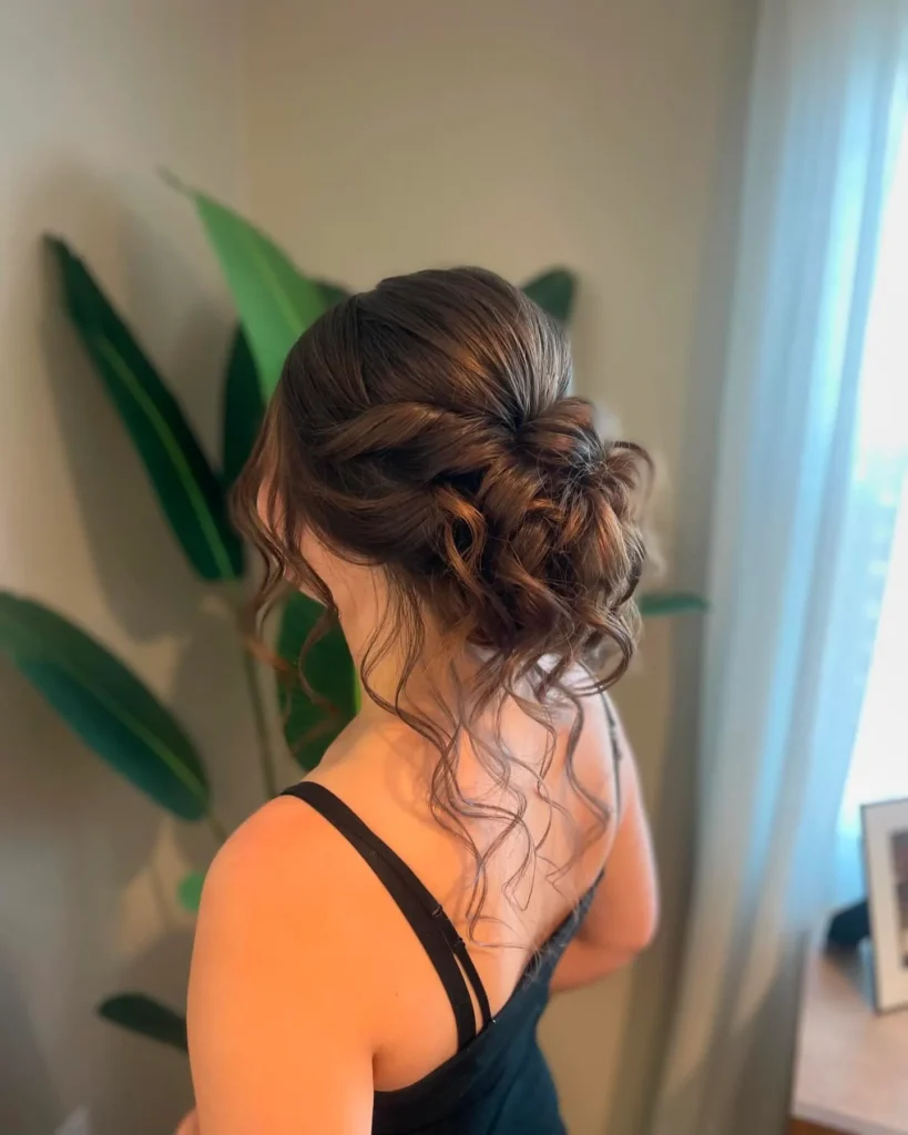 Romantic loose bun delicate tendrils