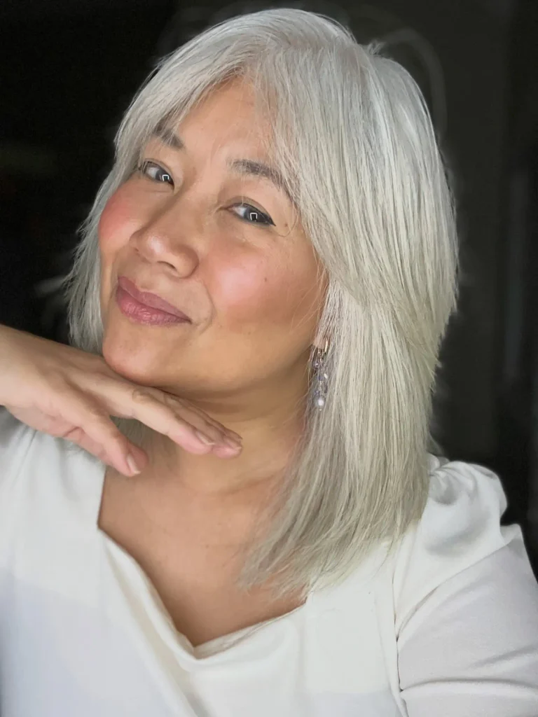 Sleek Silver Layers with Wispy Bangs