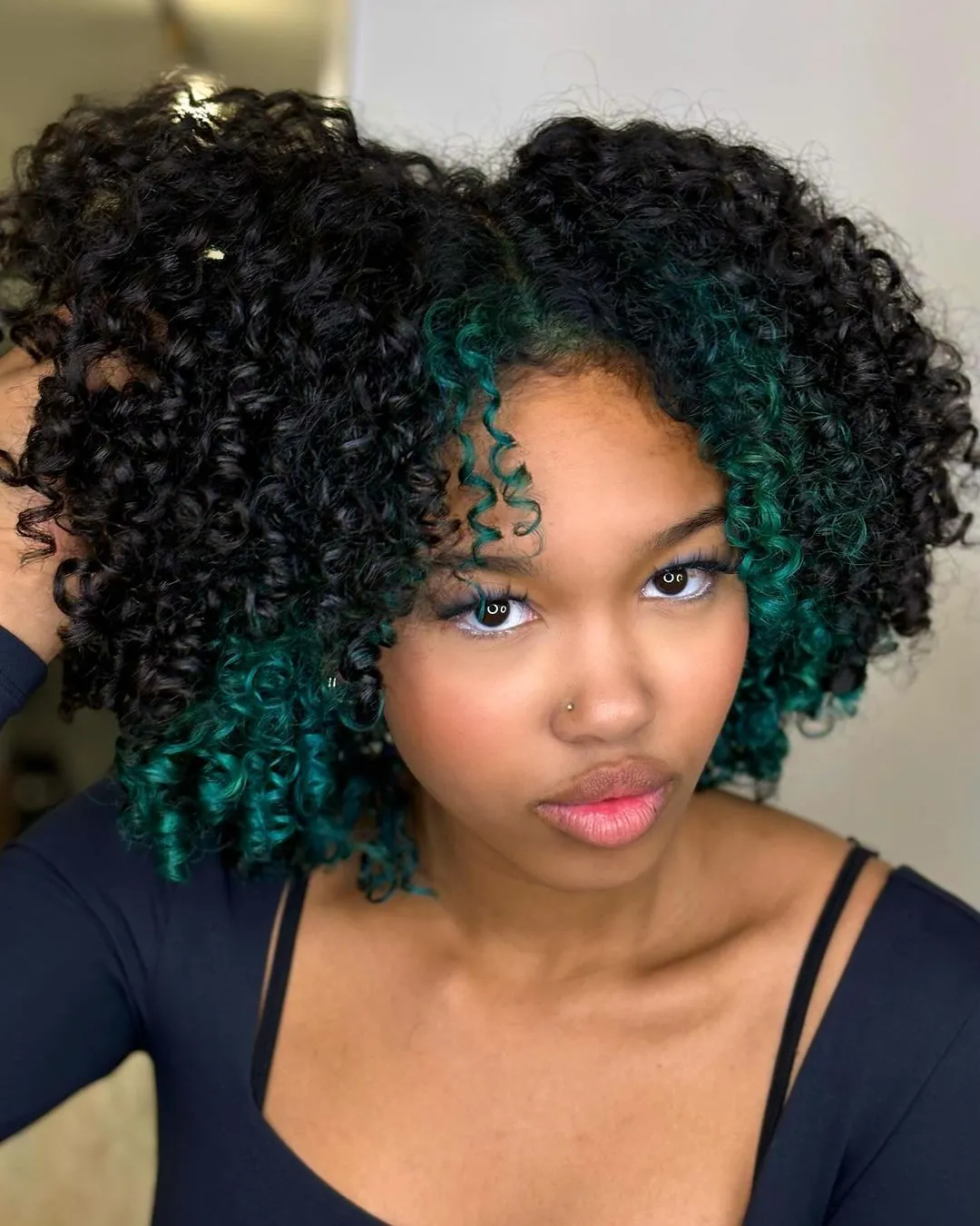Teal Highlighted Curly Bob