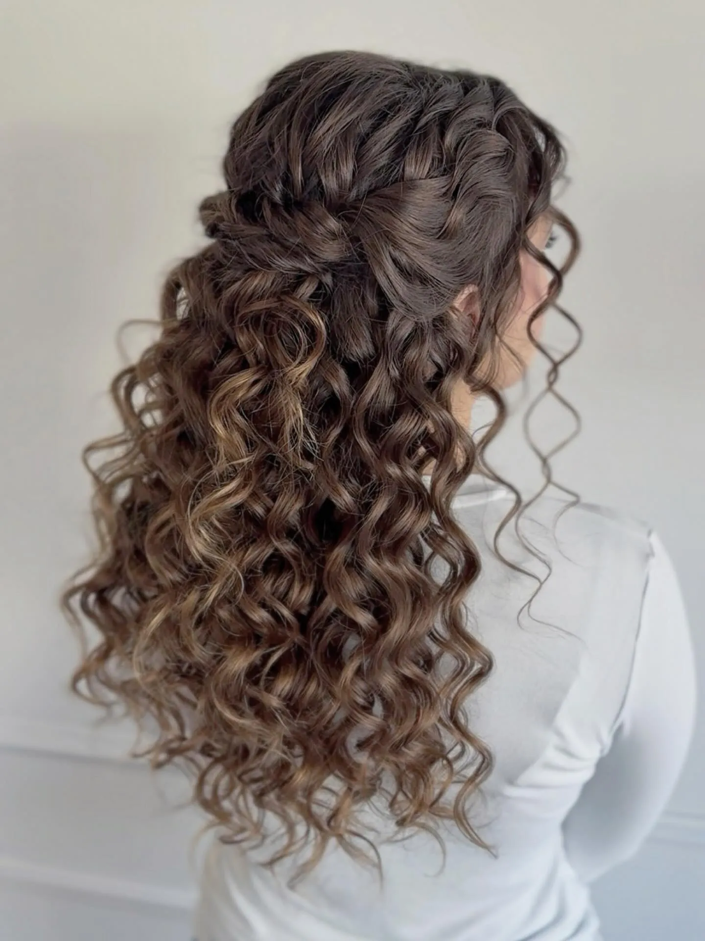 Twisted Half Up Curly Cascade
