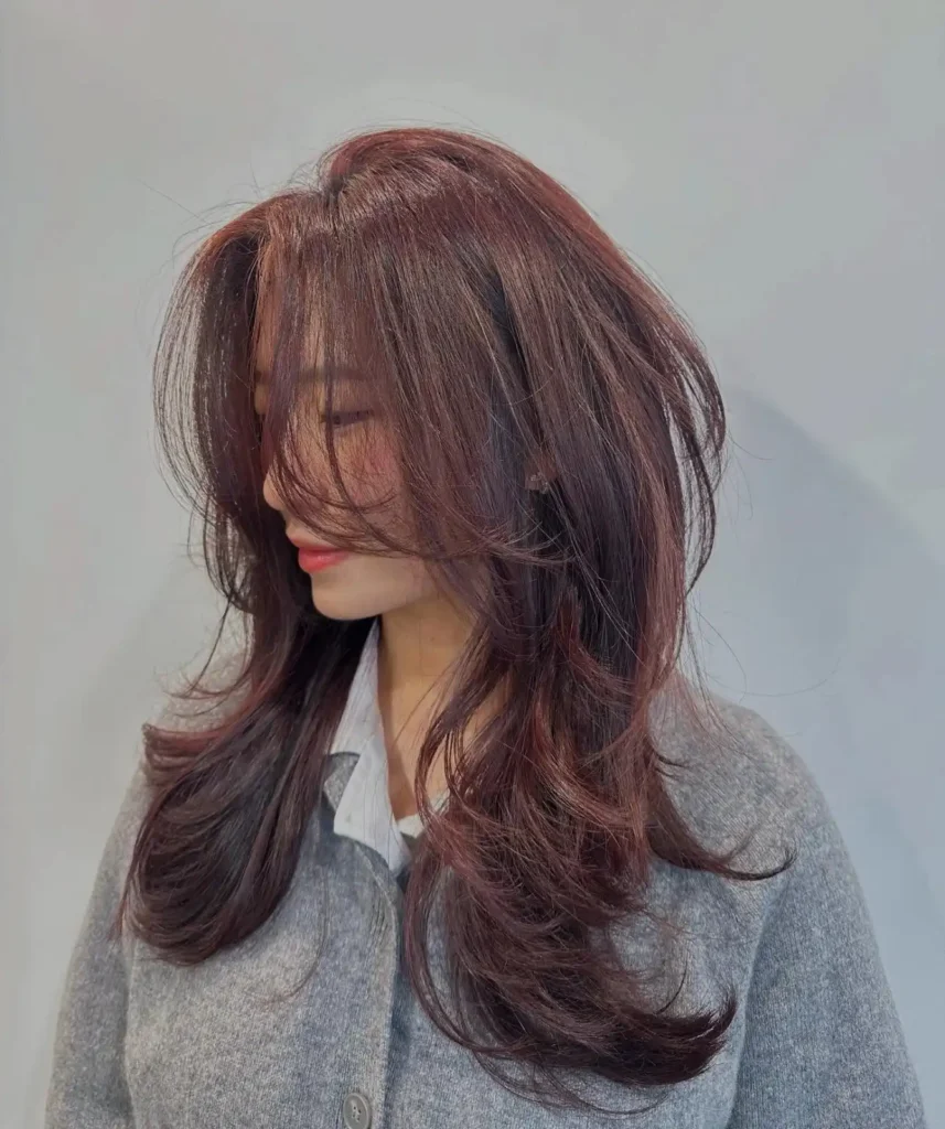 Voluminous swept feather bangs